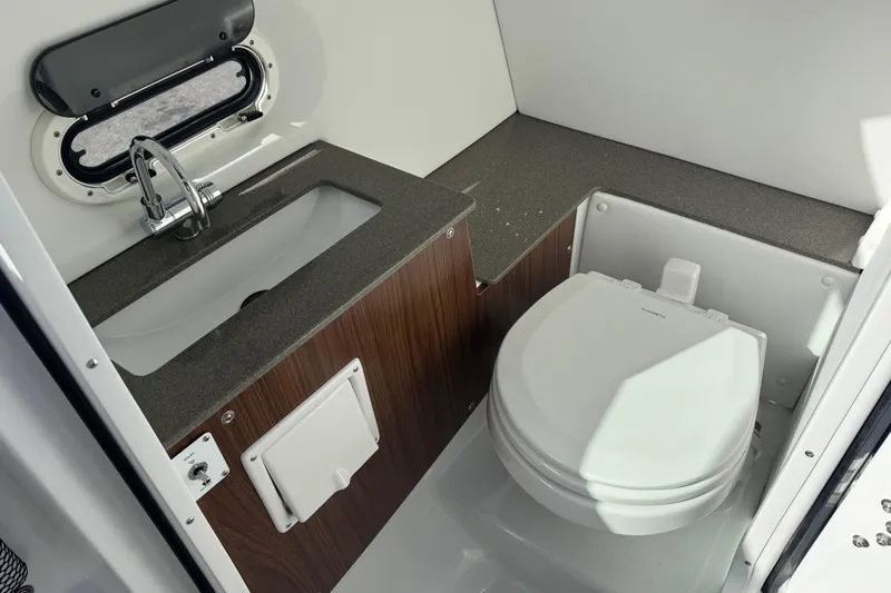  Yacht Photos Pics 2026 Four Winns HD8 OB boat bathroom with sink and toilet.