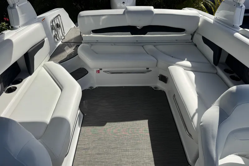  Yacht Photos Pics 2026 Four Winns HD8 OB boat interior with white seating and gray flooring.