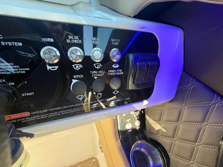  Yacht Photos Pics Control panel of 2023 Sea Ray 280 SLX boat with various switches and warning label.
