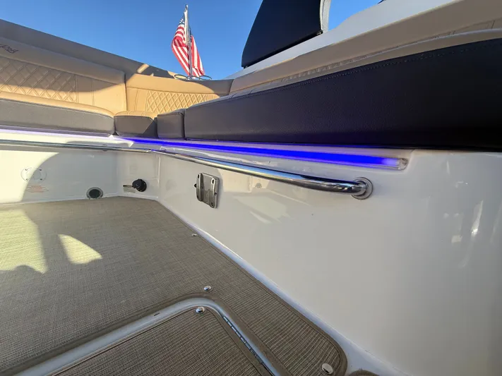  Yacht Photos Pics Interior of 2023 Sea Ray 280 SLX boat with seating and American flag.