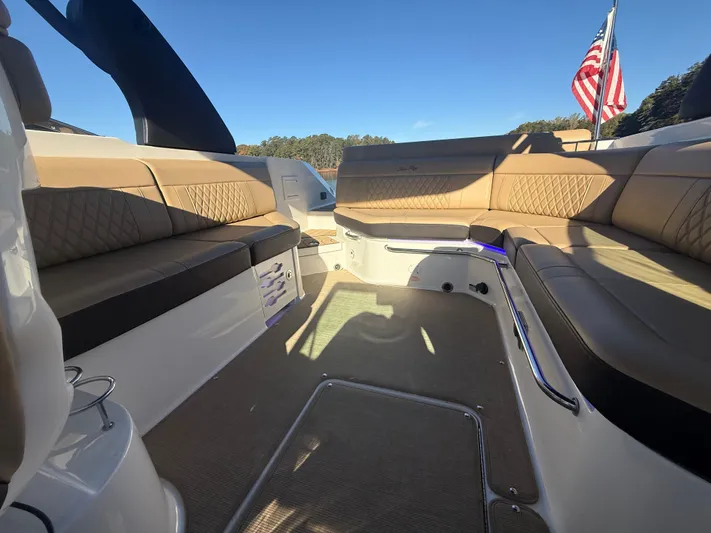  Yacht Photos Pics Interior of 2023 Sea Ray 280 SLX boat with luxurious seating and American flag.