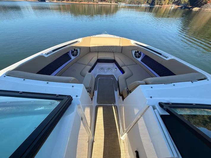  Yacht Photos Pics 2023 Sea Ray 280 SLX boat interior with luxurious seating on a calm lake.