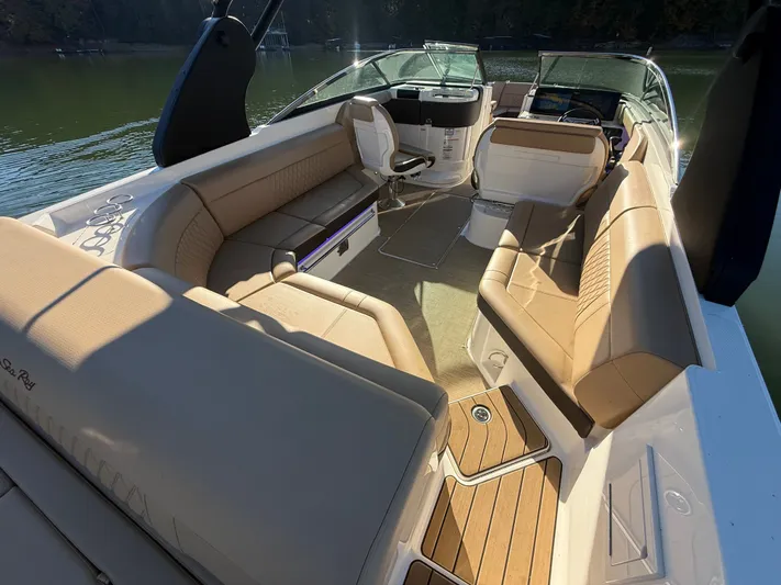  Yacht Photos Pics Luxurious interior of 2023 Sea Ray 280 SLX boat with tan seating and wood accents.
