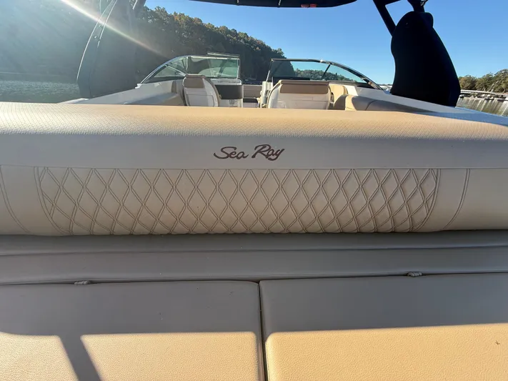  Yacht Photos Pics 2023 Sea Ray 280 SLX boat interior with beige upholstery and logo.