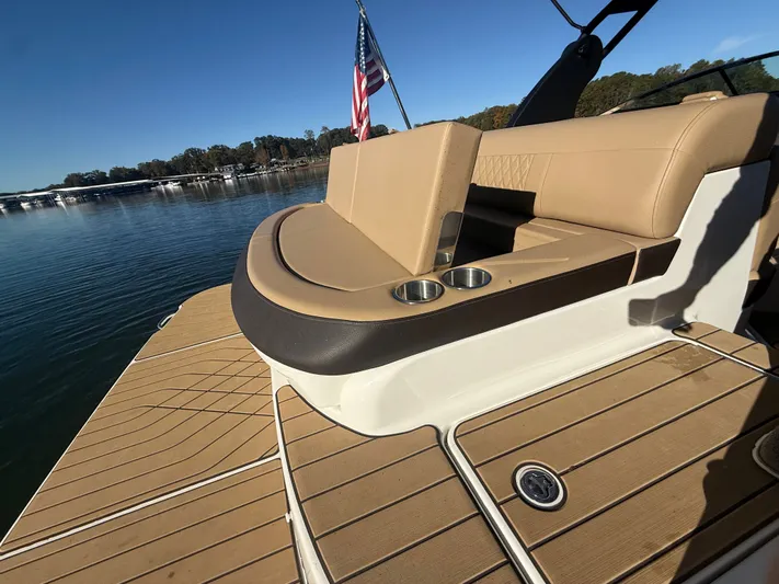  Yacht Photos Pics 2023 Sea Ray 280 SLX boat with tan seating and cup holders on a sunny day.