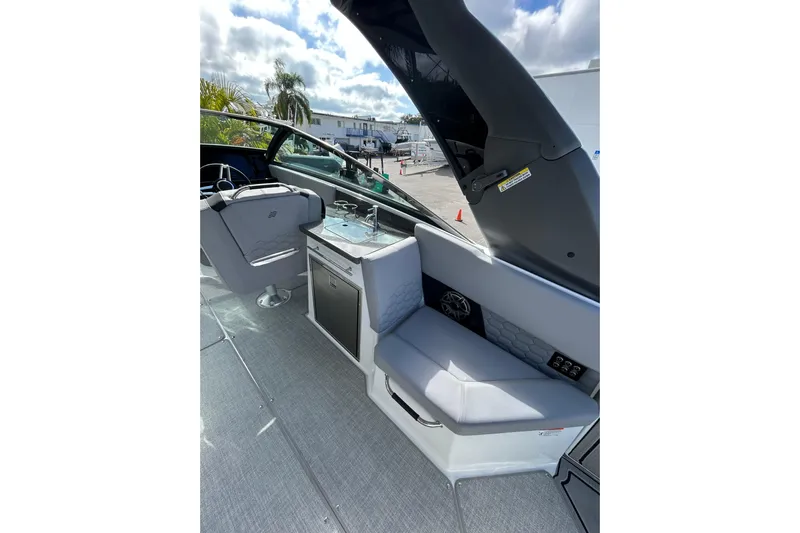  Yacht Photos Pics 2026 Four Winns H9 OB boat interior with seating and kitchenette.