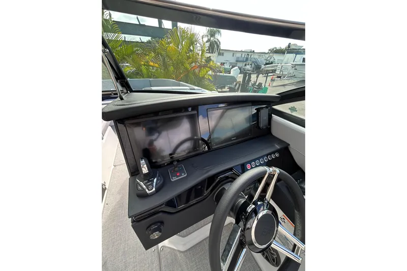  Yacht Photos Pics 2026 Four Winns H9 OB boat dashboard with modern controls and dual screens.