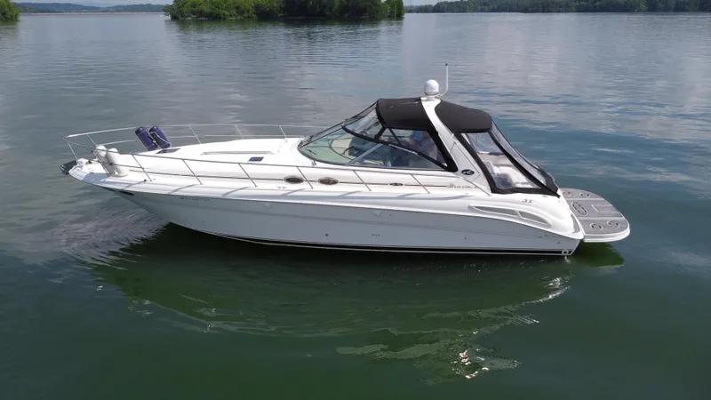  Yacht Photos Pics 2000 Sea Ray 410 Sundancer yacht on calm lake waters.