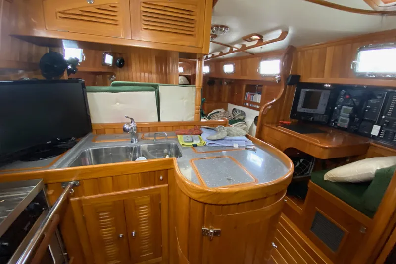 Elation Yacht Photos Pics Luxurious 2005 Cabo Rico 42 Cutter yacht interior with wood finish and modern amenities.