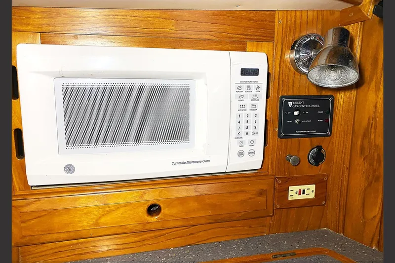 Elation Yacht Photos Pics Microwave and control panel in 2005 Cabo Rico 42 Cutter yacht kitchen.