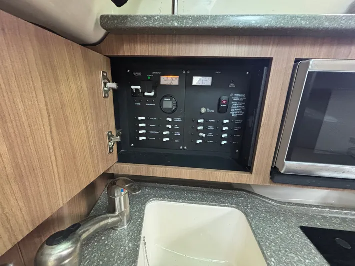  Yacht Photos Pics Electrical panel inside 2014 Boston Whaler 285 Conquest boat, featuring switches and controls.