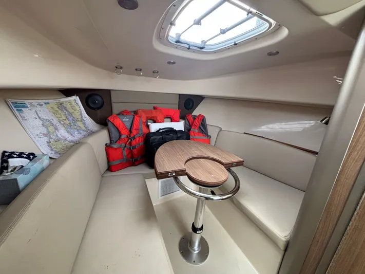 Yacht Photos Pics Interior of 2014 Boston Whaler 285 Conquest with life jackets and nautical map.