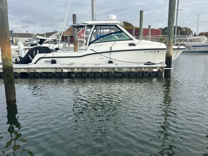  Yacht Photos Pics 2014 Boston Whaler 285 Conquest docked at marina, side view.