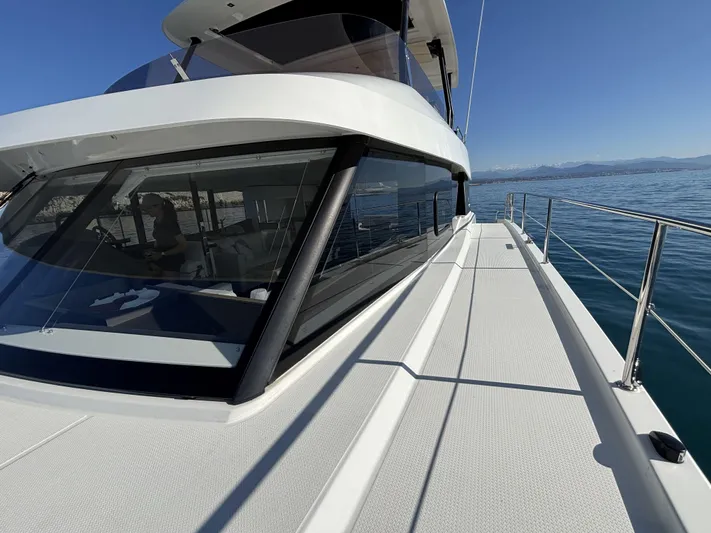 Barcajack Yacht Photos Pics 2022 Fountaine Pajot MY6 yacht, sleek design, cruising on calm blue waters.
