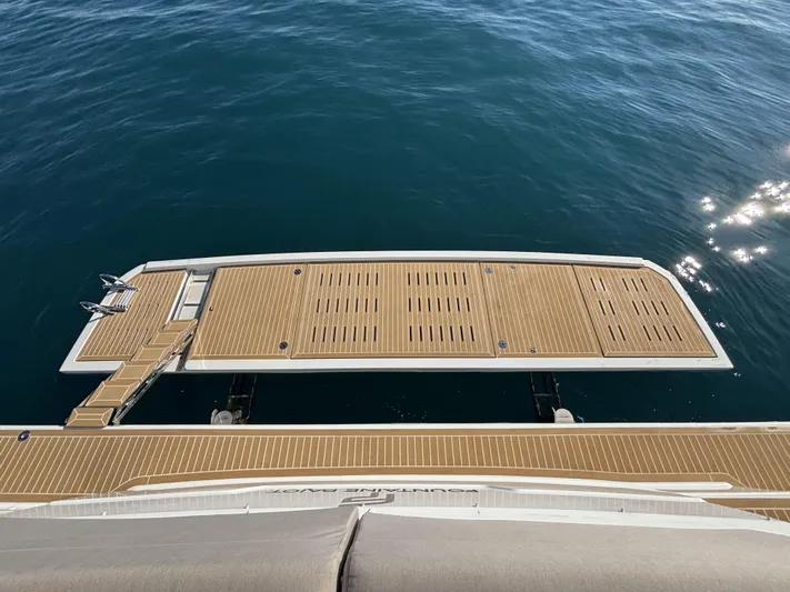 Barcajack Yacht Photos Pics 2022 Fountaine Pajot MY6 yacht deck with wooden finish on calm water.