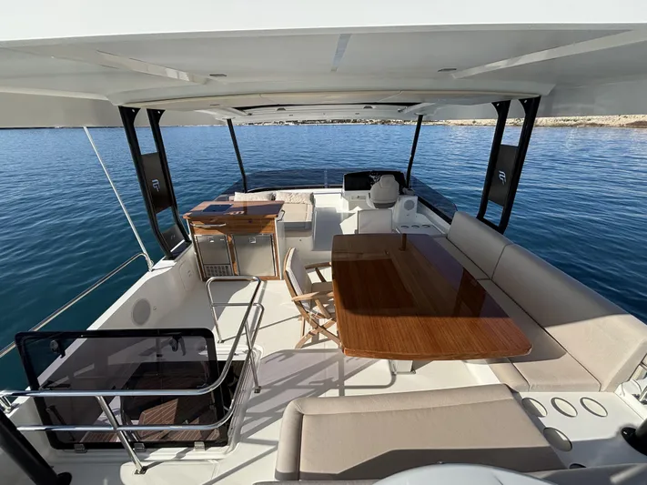 Barcajack Yacht Photos Pics Luxurious 2022 Fountaine Pajot MY6 yacht interior with spacious seating and dining area.