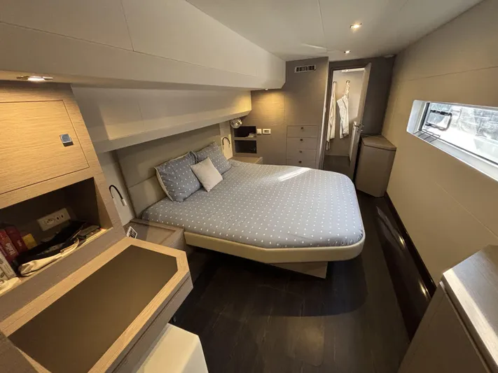 Barcajack Yacht Photos Pics Luxurious cabin interior of 2022 Fountaine Pajot MY6 yacht, featuring a cozy bed and modern design.