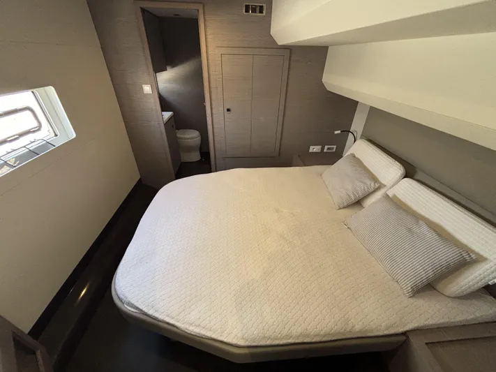 Barcajack Yacht Photos Pics Luxurious bedroom in 2022 Fountaine Pajot MY6 yacht with ensuite bathroom.