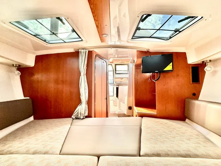  Yacht Photos Pics Interior of 2025 Cutwater C-288 Coupe, featuring cozy seating and a mounted TV.
