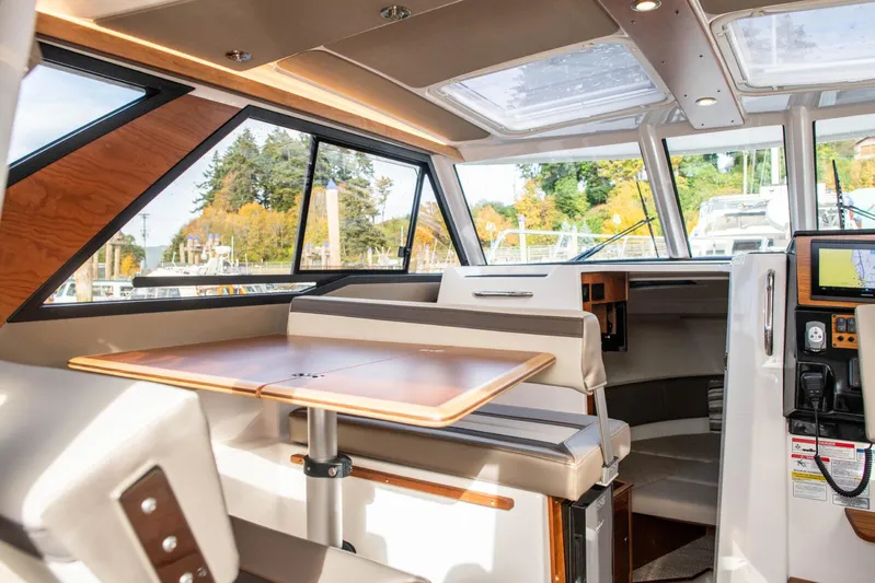  Yacht Photos Pics Interior of 2025 Cutwater C-288 Coupe, featuring modern seating and panoramic windows.