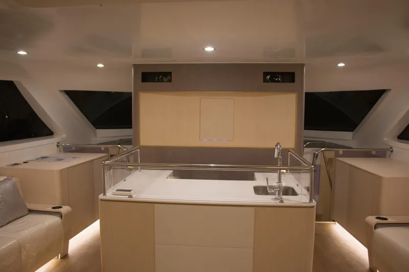  Yacht Photos Pics Luxurious interior of 2025 Mazarin Catamaran HSF-58 with modern kitchen and seating area.