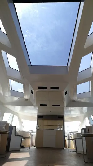  Yacht Photos Pics Interior view of 2025 Mazarin Catamaran HSF-58 with large skylights and modern design.