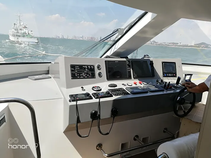  Yacht Photos Pics Modern Mazarin Catamaran HSF-58 cockpit with advanced navigation controls, 2025 model.