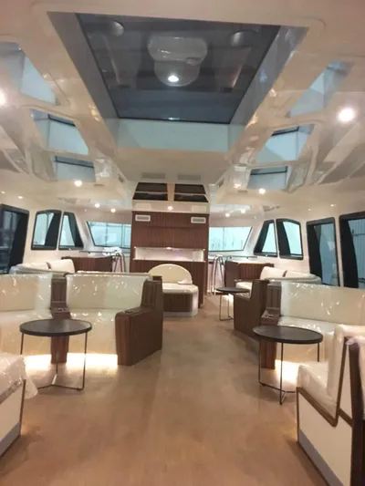  Yacht Photos Pics Luxurious interior of 2025 Mazarin Catamaran HSF-58 with modern seating and skylight.