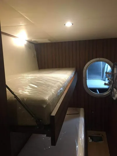  Yacht Photos Pics Interior of 2025 Mazarin Catamaran HSF-58 with bunk beds and porthole window.