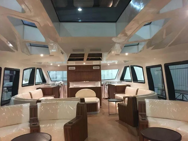  Yacht Photos Pics Luxurious interior of 2025 Mazarin Catamaran HSF-58 with modern seating and skylights.