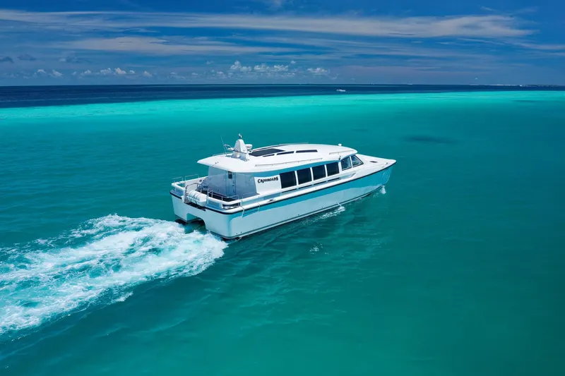  Yacht Photos Pics Mazarin Catamaran HSF-58 cruising in turquoise waters, 2025 model.