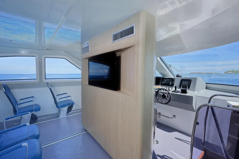  Yacht Photos Pics Interior of 2025 Mazarin Catamaran HSF-58 with modern seating and navigation controls.