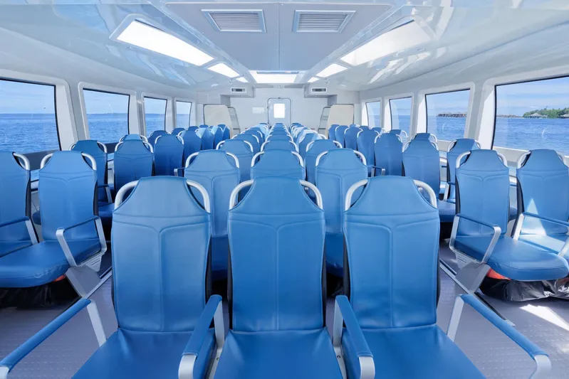  Yacht Photos Pics Interior of 2025 Mazarin Catamaran HSF-58 with blue seating and ocean view.