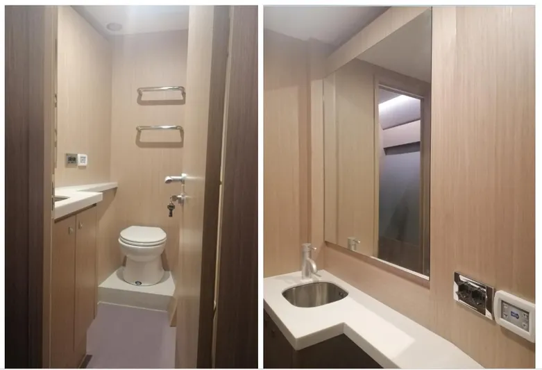  Yacht Photos Pics Modern bathroom interior of 2025 Mazarin Catamaran HSF-58, featuring sleek fixtures and wood paneling.