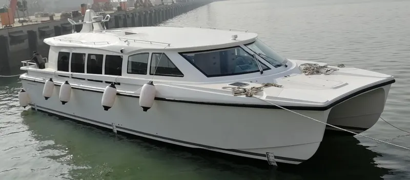  Yacht Photos Pics Mazarin Catamaran HSF-58, 2025 model, docked in calm waters.