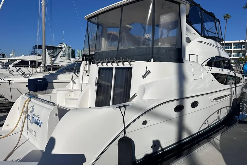 Blue Yonder Yacht Photos Pics 2004 Meridian 459 Motoryacht docked at marina under clear blue sky.
