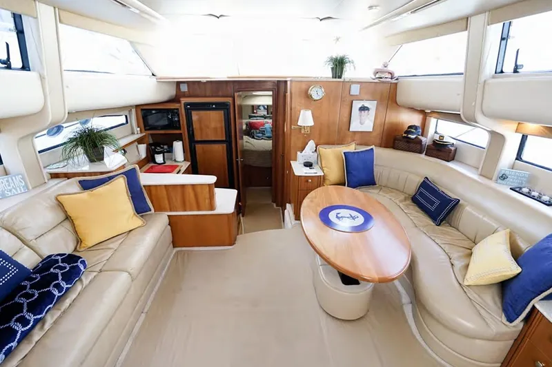 Blue Yonder Yacht Photos Pics Luxurious interior of 2004 Meridian 459 Motoryacht with plush seating and elegant decor.