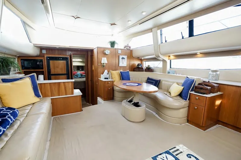 Blue Yonder Yacht Photos Pics Luxurious interior of 2004 Meridian 459 Motoryacht with plush seating and elegant decor.