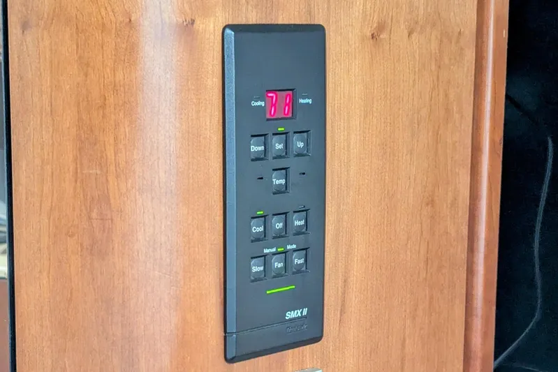  Yacht Photos Pics Control panel on 2000 Cruisers Yachts 3870 Express, displaying temperature settings.