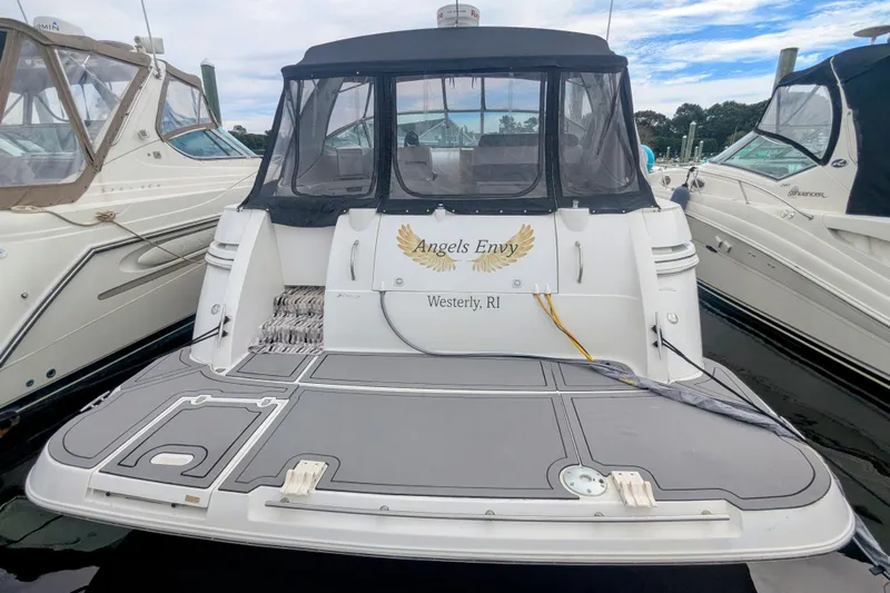  Yacht Photos Pics 2000 Cruisers Yachts 3870 Express docked, featuring "Angels Envy" nameplate, Westerly, RI.