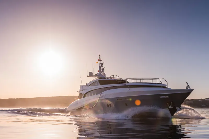 Benita Blue Yacht Photos Pics Luxury 2005 Evolution Yachts Custom cruising at sunset on calm waters.