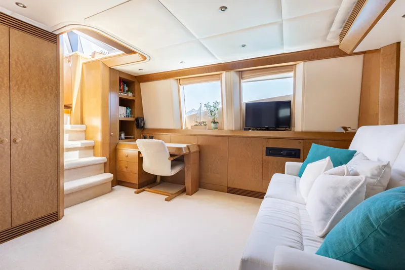Benita Blue Yacht Photos Pics Luxurious 2005 Evolution Yachts Custom interior with desk, sofa, and TV.