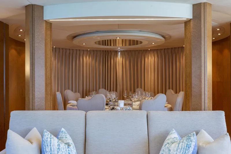 Benita Blue Yacht Photos Pics Luxurious dining area on 2005 Evolution Yachts Custom, featuring elegant decor and plush seating.