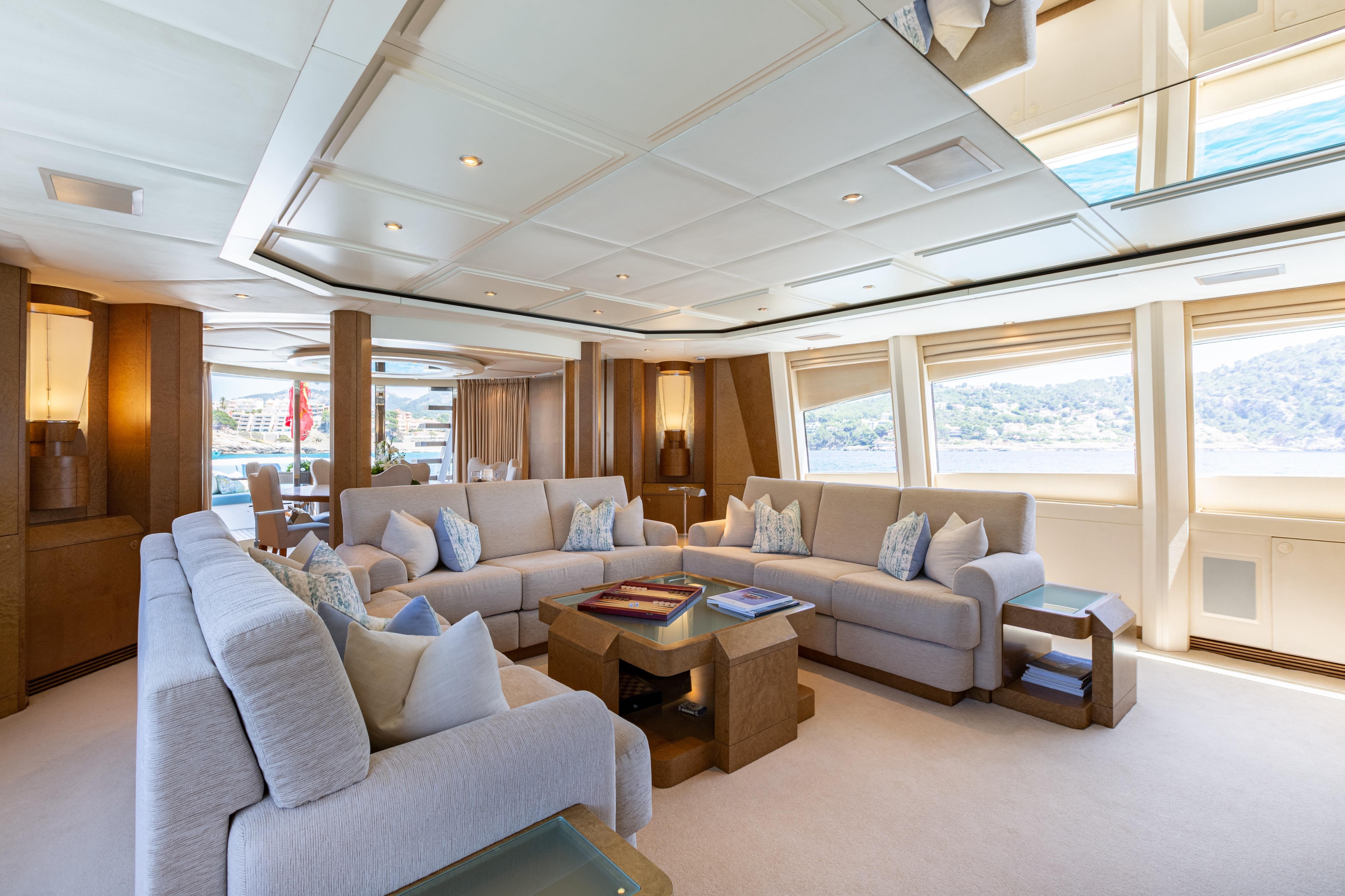 Luxurious interior of 2005 Evolution Yachts Custom model with elegant seating and panoramic windows.