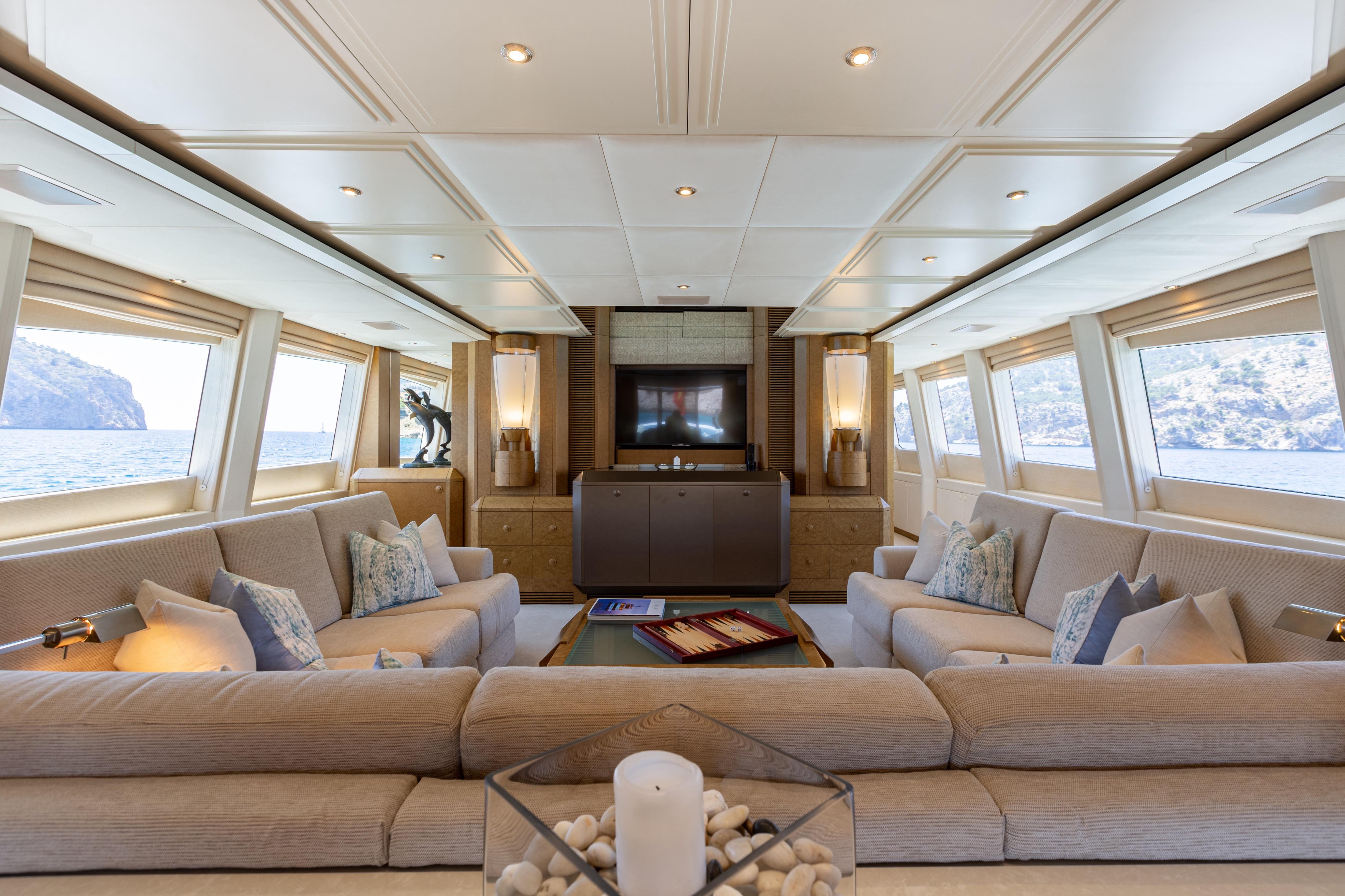 Luxurious interior of 2005 Evolution Yachts Custom model, featuring elegant seating and scenic ocean views.