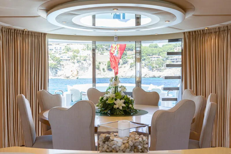 Benita Blue Yacht Photos Pics Luxurious dining area on 2005 Evolution Yachts Custom, featuring elegant decor and scenic ocean view.