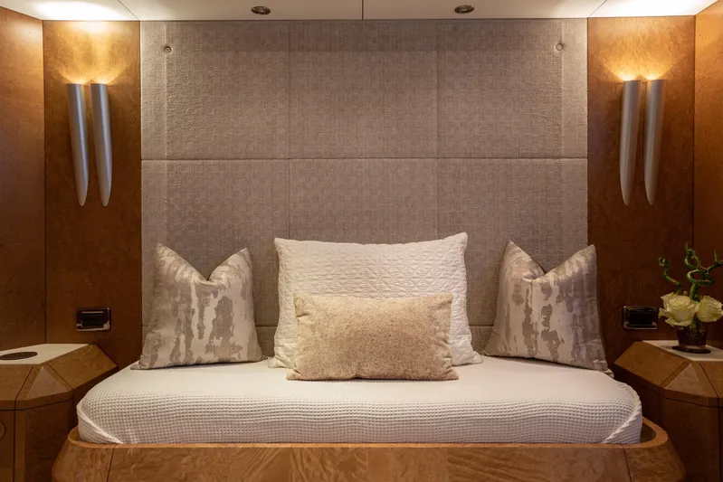 Benita Blue Yacht Photos Pics Luxurious 2005 Evolution Yachts Custom bedroom with elegant bedding and ambient lighting.