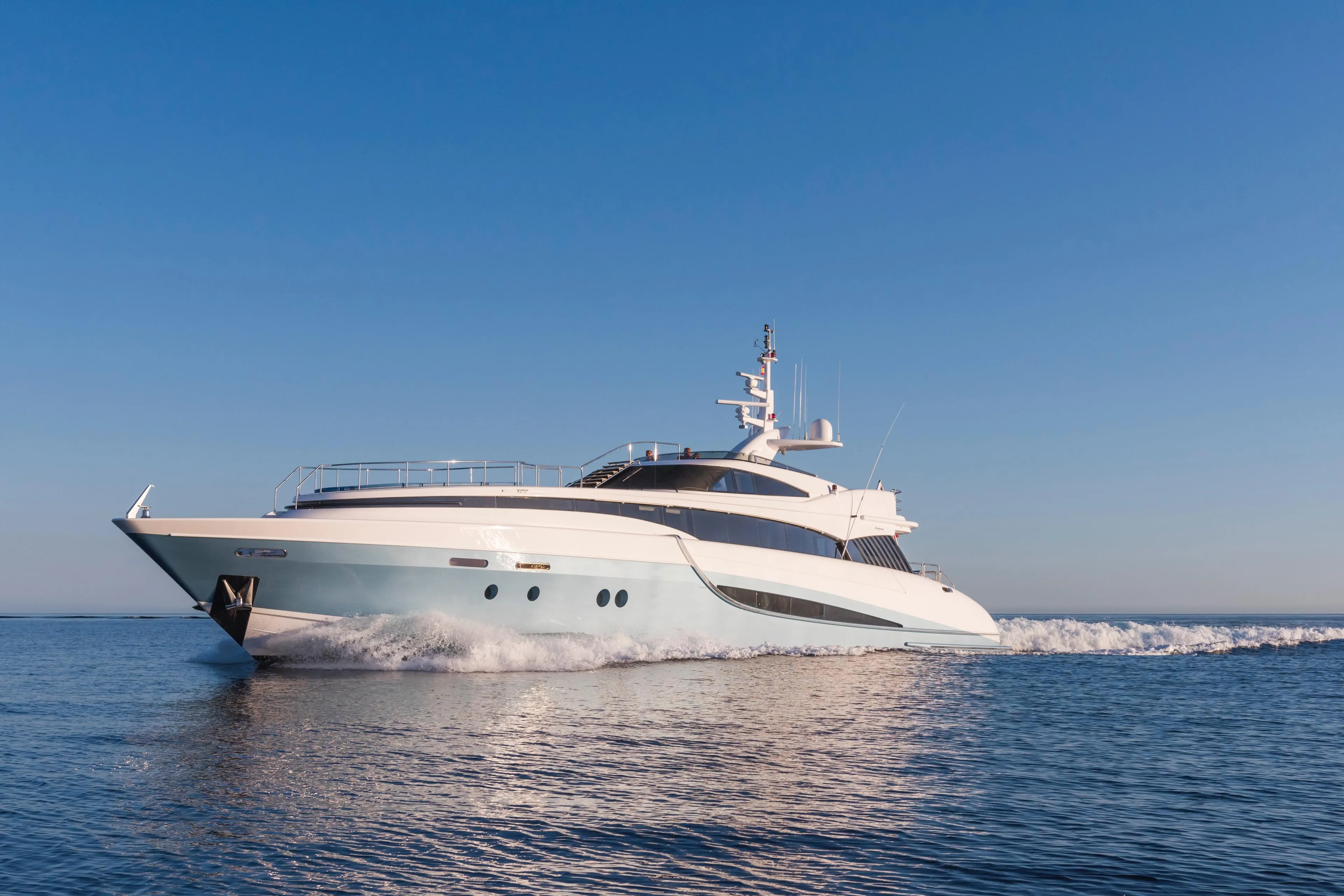 Luxury 2005 Evolution Yachts Custom cruising on open water under clear blue sky.