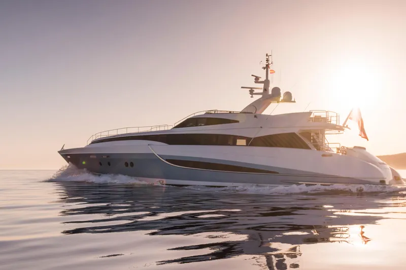 Benita Blue Yacht Photos Pics Luxurious 2005 Evolution Yachts Custom cruising at sunset on calm waters.