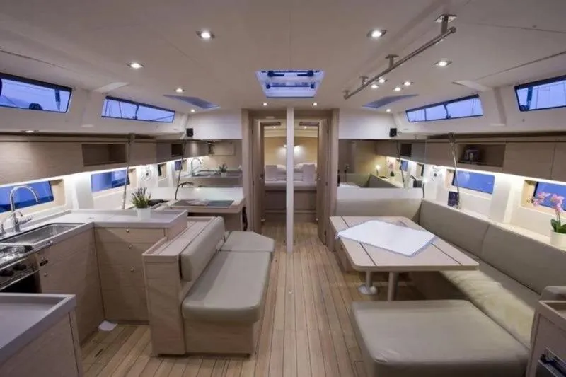 Miss Alice Yacht Photos Pics Luxurious interior of 2018 Beneteau 51.1 yacht with modern kitchen and seating area.